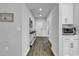 Inviting hallway featuring wood floors, white trim, and tasteful decor at 1463 Villena Dr., Myrtle Beach, SC 29579