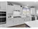 Bright white kitchen features stainless appliances, a gas cooktop, and ample counter space at 1463 Villena Dr., Myrtle Beach, SC 29579