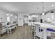 Open kitchen and dining area with white cabinets, stainless steel appliances, and center island at 1463 Villena Dr., Myrtle Beach, SC 29579
