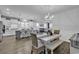 Open-concept living space features kitchen, dining, and living area with hardwood floors at 1463 Villena Dr., Myrtle Beach, SC 29579