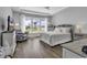 Spacious main bedroom features a tray ceiling, hardwood floors and a relaxing sitting area at 1463 Villena Dr., Myrtle Beach, SC 29579