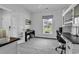 Bright home office featuring a built-in desk, piano, and view of the outdoors at 1463 Villena Dr., Myrtle Beach, SC 29579