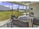 The screened-in patio offers a serene outdoor space with lake view at 1463 Villena Dr., Myrtle Beach, SC 29579