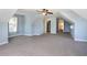Spacious carpeted bedroom with natural light, a ceiling fan, and closet access at 1800 Wood Stork Dr., Conway, SC 29526