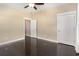 Empty bedroom featuring a ceiling fan, hardwood floors, and an open doorway at 1800 Wood Stork Dr., Conway, SC 29526