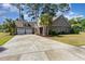 A well-maintained home with a spacious driveway and attached two-car garage at 1800 Wood Stork Dr., Conway, SC 29526