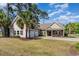 Charming home with a two-car garage, palm trees, and a well-manicured lawn at 1800 Wood Stork Dr., Conway, SC 29526