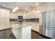 Spacious kitchen with white cabinets, granite countertops, and stainless steel appliances at 1800 Wood Stork Dr., Conway, SC 29526
