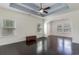 Spacious living room with hardwood floors, white trim and ceiling fan at 1800 Wood Stork Dr., Conway, SC 29526