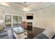 Cozy living room features a fireplace, sliding glass doors, hardwood floors, and comfortable seating at 1800 Wood Stork Dr., Conway, SC 29526