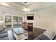 Cozy living room with a fireplace and sliding glass doors that lead to outdoor living at 1800 Wood Stork Dr., Conway, SC 29526