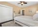 Main bedroom with a dresser, closet, ceiling fan, and a door to another room at 1800 Wood Stork Dr., Conway, SC 29526
