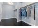 Walk-in closet with ample hanging space, rods on two walls, and wood floors at 1800 Wood Stork Dr., Conway, SC 29526