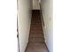 Clean stairway with neutral carpeting and white walls provides access to upper levels at 1870 Auburn Ln. # 21 E, Surfside Beach, SC 29575