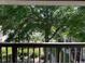 Picturesque view from the balcony overlooking lush greenery and distant water feature at 1870 Auburn Ln. # 21 E, Surfside Beach, SC 29575