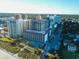 Aerial view of a beachfront resort featuring pools, sun loungers, and easy access to the sandy beach at 201 77Th Ave. N # 828, Myrtle Beach, SC 29572