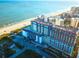 Stunning aerial view of a beachfront hotel complex, showcasing its prime location and expansive ocean views at 201 77Th Ave. N # 828, Myrtle Beach, SC 29572