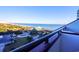 Balcony view overlooking a sandy beach, bright blue ocean, and surrounding neighborhood at 201 77Th Ave. N # 828, Myrtle Beach, SC 29572