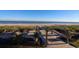 Scenic beach access point over dunes, featuring sandy shores and tranquil ocean views under a clear sky at 201 77Th Ave. N # 828, Myrtle Beach, SC 29572