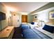 Restful bedroom with two beds, a dresser, side table and tasteful decor at 201 77Th Ave. N # 828, Myrtle Beach, SC 29572