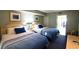 Inviting bedroom with two beds, soft lighting, and tasteful decor at 201 77Th Ave. N # 828, Myrtle Beach, SC 29572