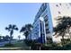 Exterior view of Grande Shores, showcasing its architecture, lush landscaping, and proximity to the beach at 201 77Th Ave. N # 828, Myrtle Beach, SC 29572