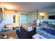 Comfortable living area with sleeper sofa, table, and convenient access to the bathroom at 201 77Th Ave. N # 828, Myrtle Beach, SC 29572