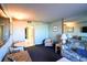 Relax in this living area with sleeper sofa, side chair and convenient access to the bathroom at 201 77Th Ave. N # 828, Myrtle Beach, SC 29572