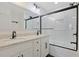 Bathroom featuring double sinks, quartz countertops, and marble tile shower and tub at 205 Double Eagle Dr. # C-2, Myrtle Beach, SC 29575