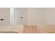Bedroom showcasing hardwood floors, two twin beds, closet doors, and beige decor at 205 Double Eagle Dr. # C-2, Myrtle Beach, SC 29575