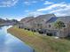 Exterior showing multi-level condos with patios, brick accents, and a view of the waterway at 205 Double Eagle Dr. # C-2, Myrtle Beach, SC 29575