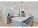 Modern kitchen with white cabinets, stainless steel appliances, and a quartz countertop island at 205 Double Eagle Dr. # C-2, Myrtle Beach, SC 29575