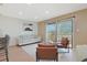 Bright living room with sliding glass doors to balcony and comfortable seating at 205 Double Eagle Dr. # C-2, Myrtle Beach, SC 29575