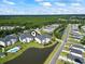 Community aerial view showcasing pool, ponds, and surrounding neighborhood at 2090 Cross Gate Blvd. # 205, Surfside Beach, SC 29575