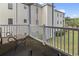 Private balcony with seating, offering a view of the surrounding community at 2090 Cross Gate Blvd. # 205, Surfside Beach, SC 29575