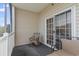 Screened balcony with seating and a view of trees at 2090 Cross Gate Blvd. # 205, Surfside Beach, SC 29575