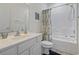 Bright bathroom featuring a white vanity, commode, decorative fixtures and a bathtub at 2090 Cross Gate Blvd. # 205, Surfside Beach, SC 29575