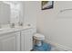 Bright bathroom featuring a white vanity, commode, and a stand up shower at 2090 Cross Gate Blvd. # 205, Surfside Beach, SC 29575