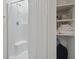 Bathroom featuring a stand-up shower with white tile surround and storage shelves at 2090 Cross Gate Blvd. # 205, Surfside Beach, SC 29575
