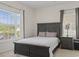 Comfortable bedroom with a large window, natural light, and neutral decor at 2090 Cross Gate Blvd. # 205, Surfside Beach, SC 29575