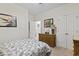 Comfortable bedroom featuring a wicker dresser, natural light and neutral walls and carpet at 2090 Cross Gate Blvd. # 205, Surfside Beach, SC 29575