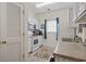 Efficient kitchen layout with white appliances and cabinets, showcasing a functional and clean design at 2090 Cross Gate Blvd. # 205, Surfside Beach, SC 29575