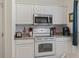 Efficient kitchen with stainless steel microwave and white appliances at 2090 Cross Gate Blvd. # 205, Surfside Beach, SC 29575