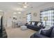 Open-concept living area with dining space, nautical decor, and comfortable seating at 2090 Cross Gate Blvd. # 205, Surfside Beach, SC 29575
