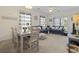 Inviting living room and dining area with stylish decor and natural light streaming through the windows at 2090 Cross Gate Blvd. # 205, Surfside Beach, SC 29575