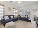 Cozy living room features blue sofas, beach-themed decor, and access to a balcony at 2090 Cross Gate Blvd. # 205, Surfside Beach, SC 29575