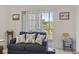 Cozy living room features a blue sofa and access to a private balcony at 2090 Cross Gate Blvd. # 205, Surfside Beach, SC 29575