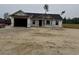 New construction home featuring a garage and windows, covered in Tyvek house wrap at 2186 Mineral Springs Rd., Conway, SC 29527
