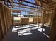 The interior of a house under construction with exposed wooden frames and a concrete floor at 2186 Mineral Springs Rd., Conway, SC 29527