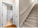 A stairway leads to a bathroom with tiled floors and shower/tub with wheat-themed curtain at 232 Je Edward Dr. # 21, Myrtle Beach, SC 29588